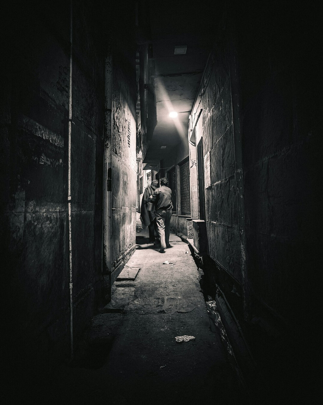 shadowy figure in alley